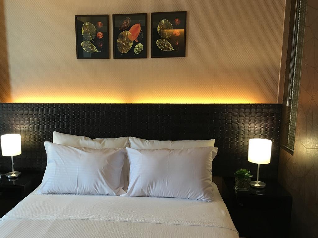 Shang Luxury Suites Мандалуйонг Номер фото