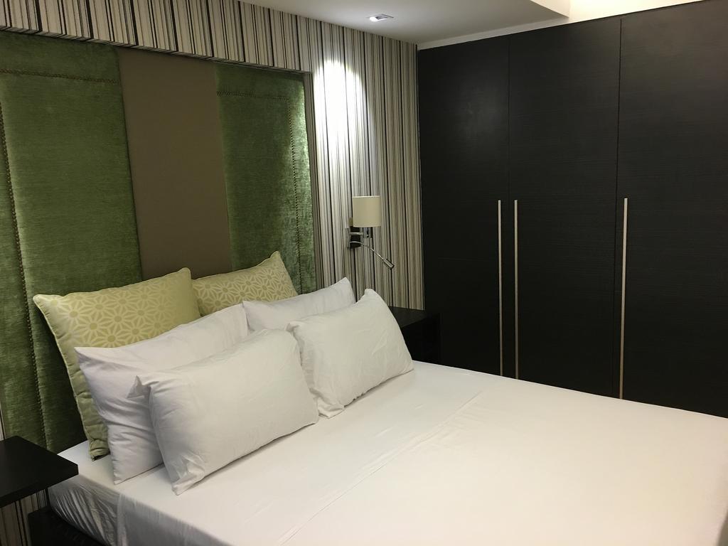 Shang Luxury Suites Мандалуйонг Номер фото