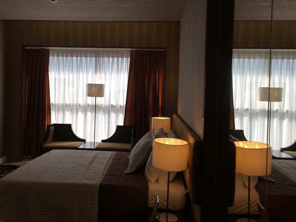 Shang Luxury Suites Мандалуйонг Номер фото